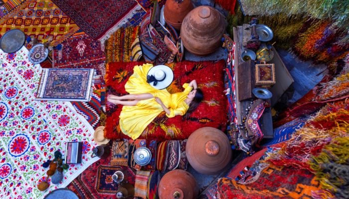 Beautiful girl at traditional carpet shop in Goreme city, Cappadocia in Turkey.